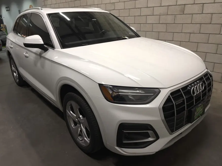 White Audi Q5 in the KCL Creations Loveland shop after dent repair