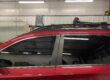 Technician installing ceramic window tint at KCL Creations in Loveland, CO.