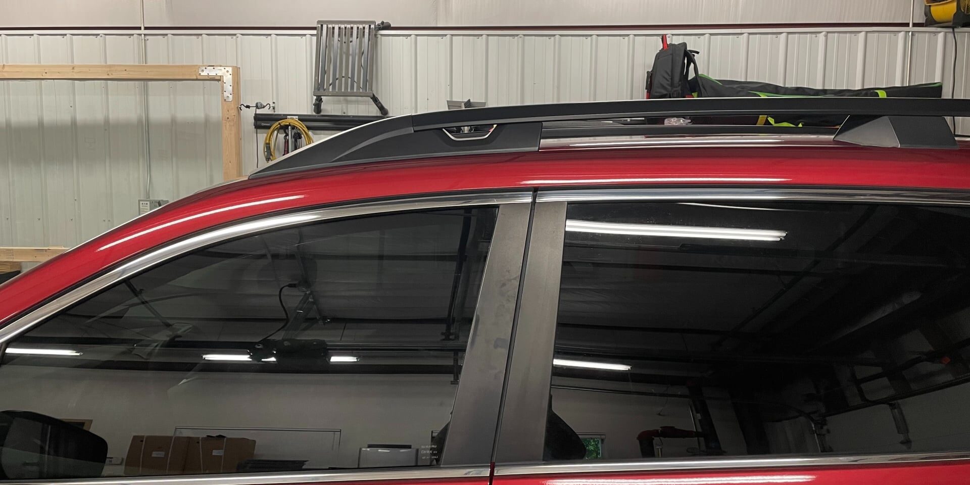 Technician installing ceramic window tint at KCL Creations in Loveland, CO.