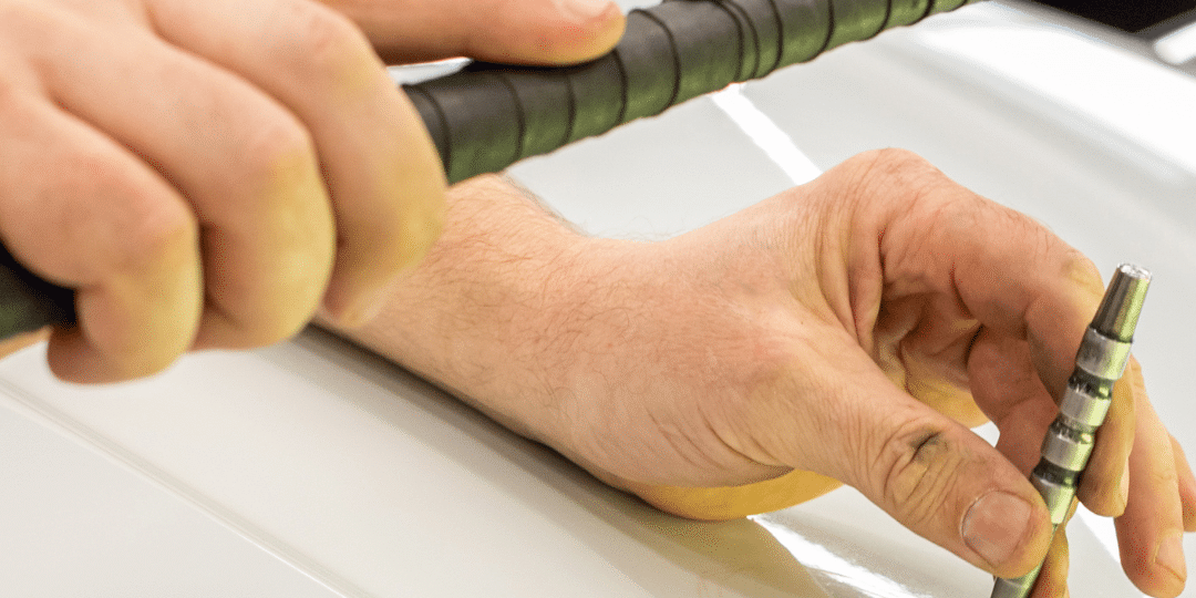 kcl oct blog images Paintless dent repair on a car in Loveland, CO, during winter conditions