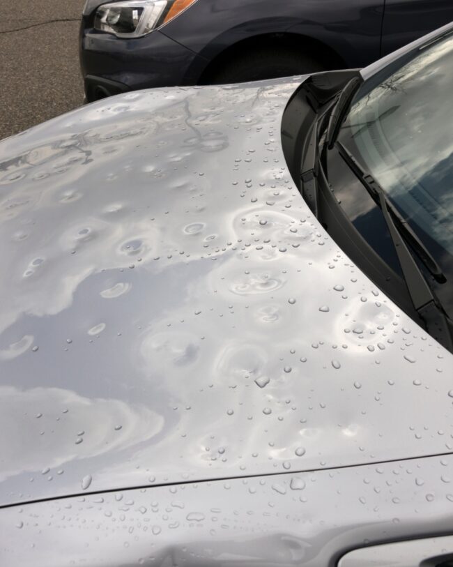 Paintless dent repair to fix hail damage on a vehicle in Northern Colorado