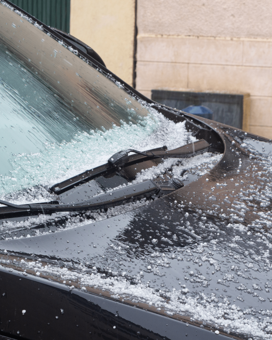 KCL Creations specialist inspecting a vehicle for hidden hail damage in Loveland.