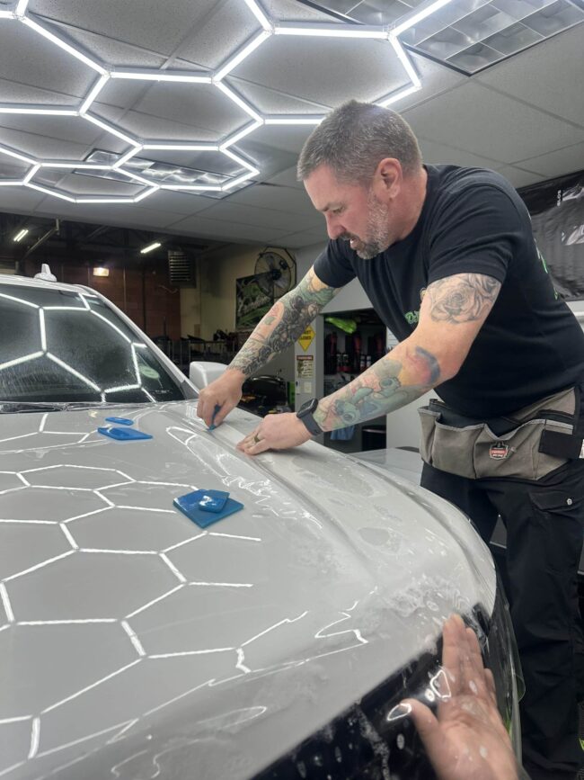 Vehicle receiving paint protection film installation at KCL Creations in Loveland, Colorado